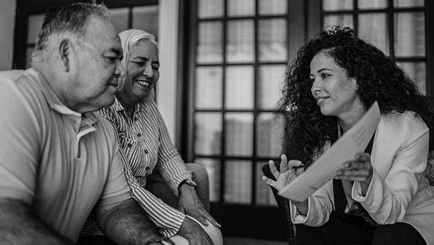 funeral director shows senior couple funeral plan