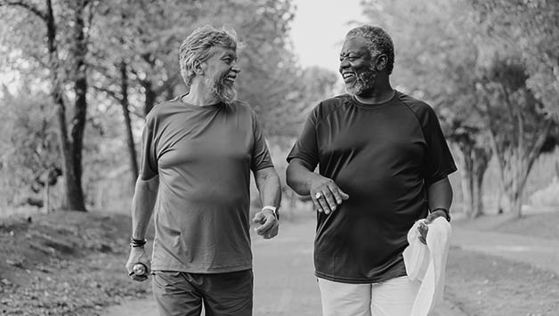 two senior men walking for healthy aging